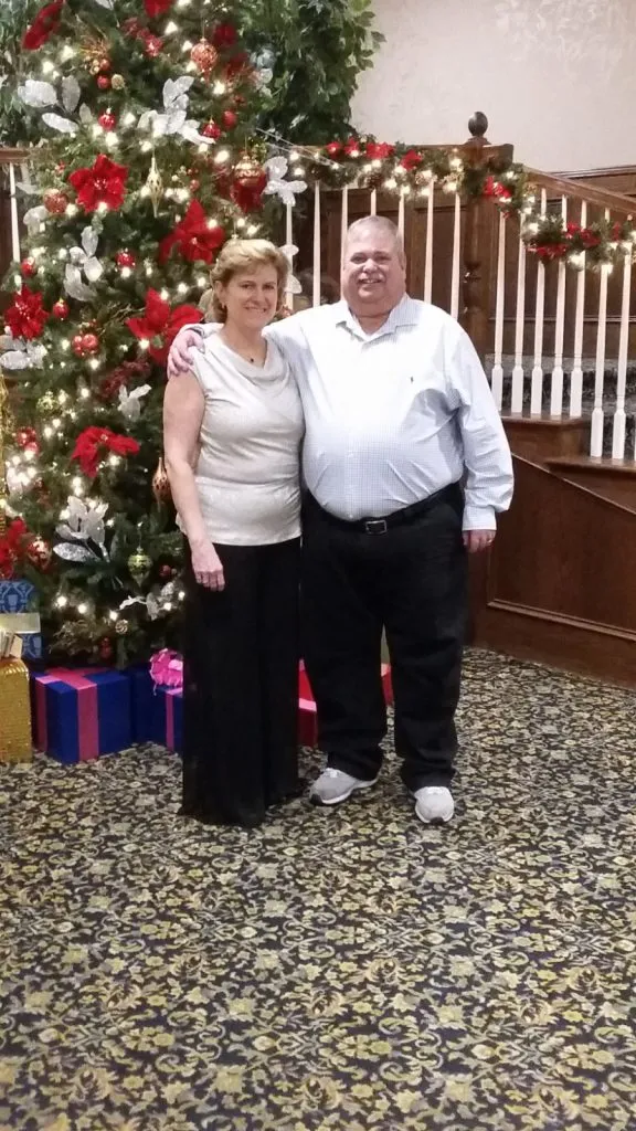 Elaine and Greg Adamo, Founders of Christmas in Clinton Township, smiling together